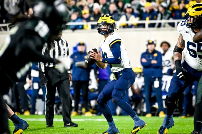 Michigan's J.J. McCarthy looks to throw against Michigan State during the second quarter on Saturday, Oct. 21, 2023, at Spartan Stadium in East Lansing.